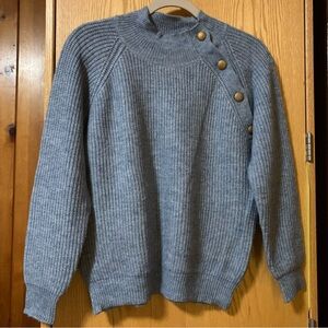 Blue winter jacket, gold buttons on side shoulder, warm and soft material